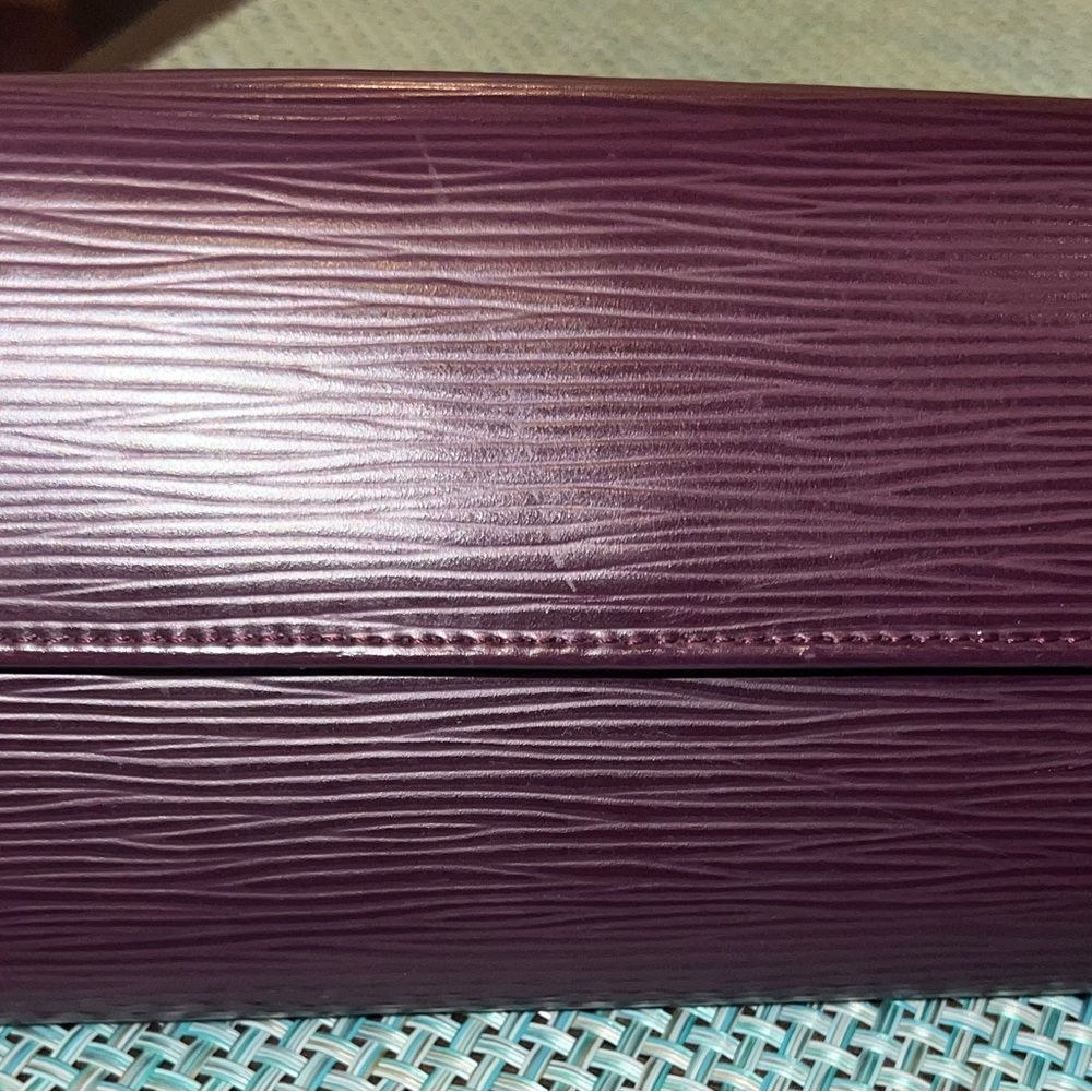 Louis Vuitton Epi Leather Sarah wallet in deep purple color